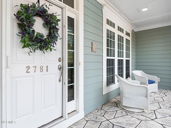 2761 Cedar Crest Drive's porch | Discover Thomas McCloskey’s property listings, the best realtor and listing agent in St. James