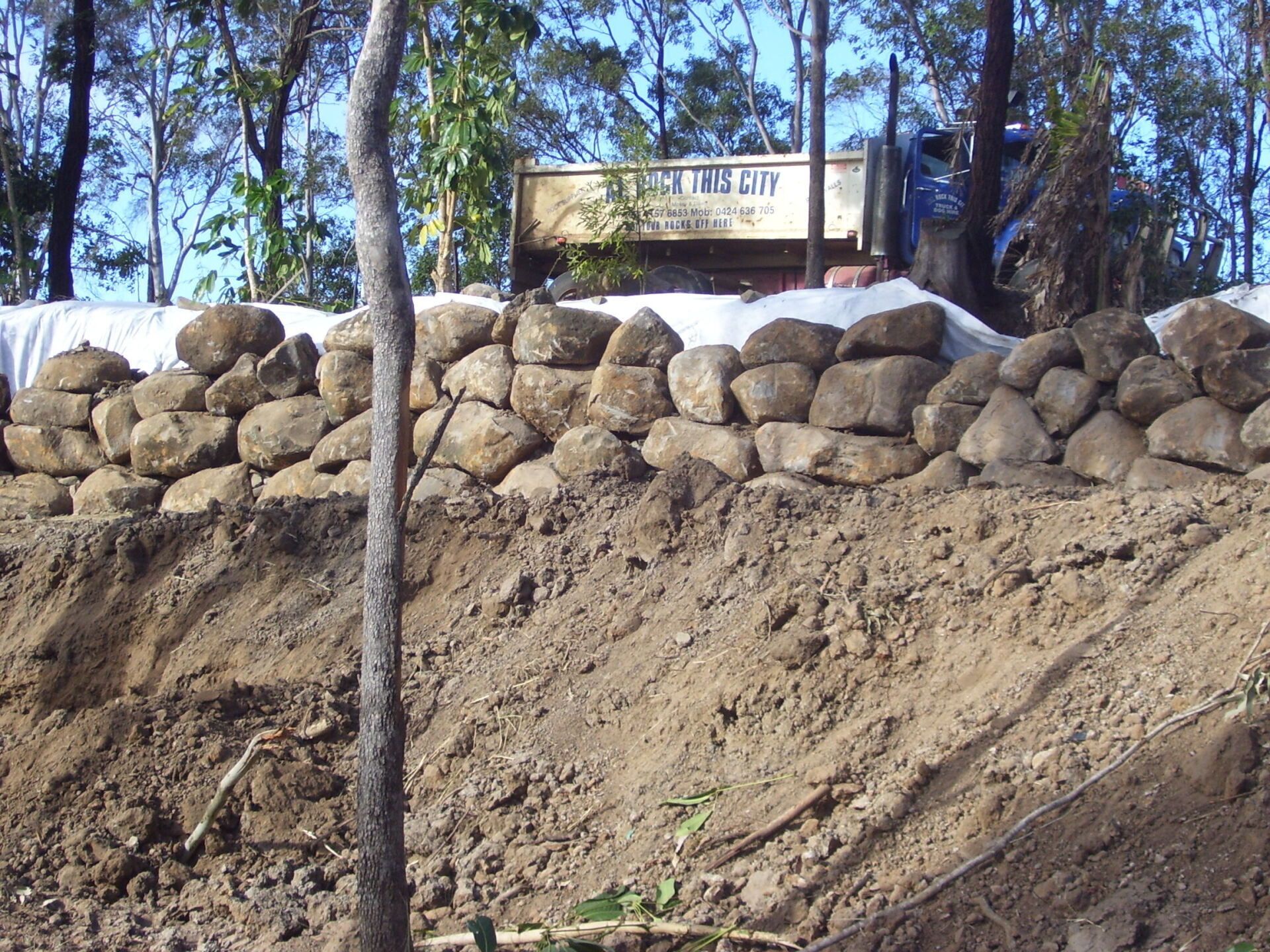 Rock Wall in Progress Far View — A1 Rock This City Truck & Dog Hire In Good Night QLD