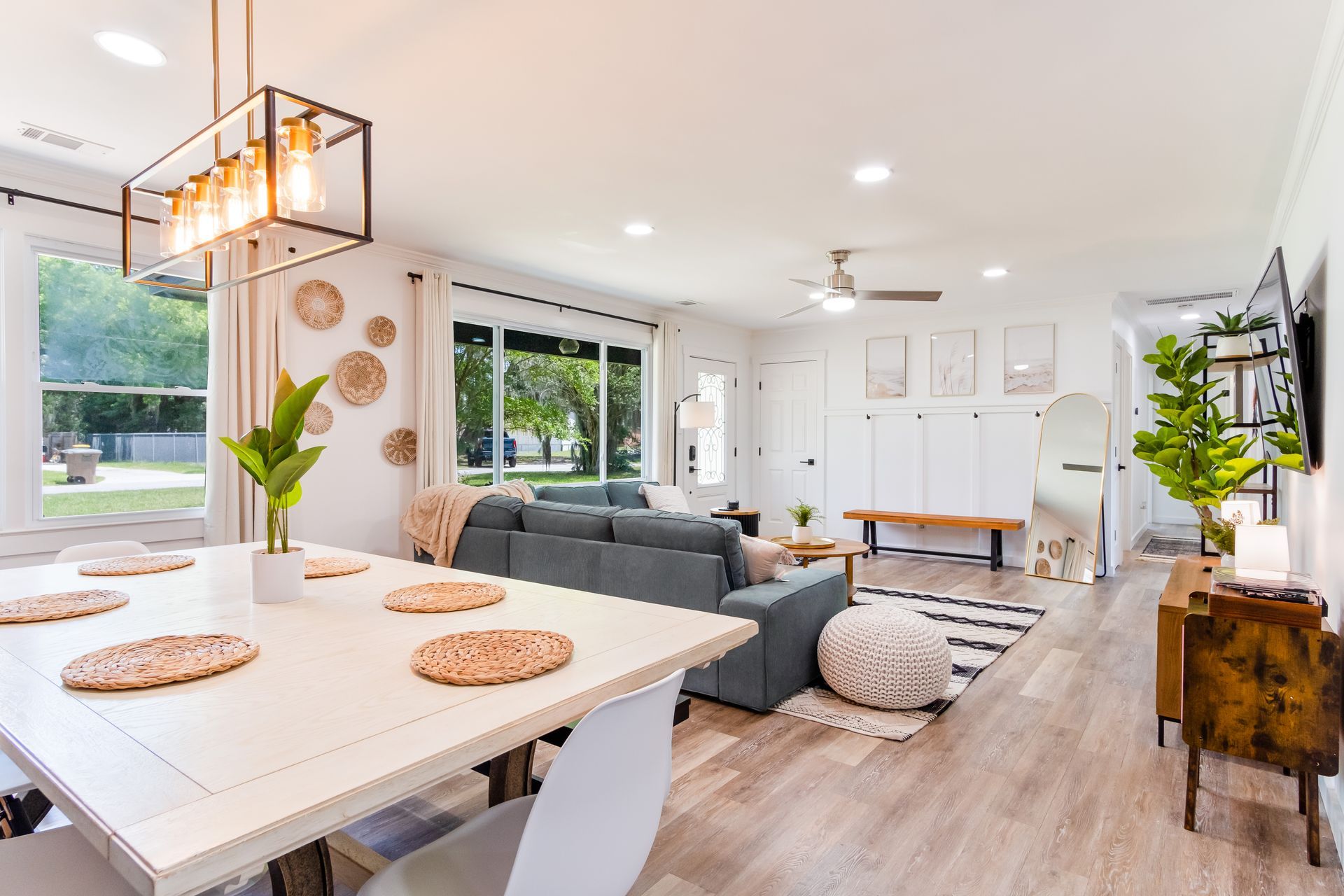 A living room with a dining table and a couch.