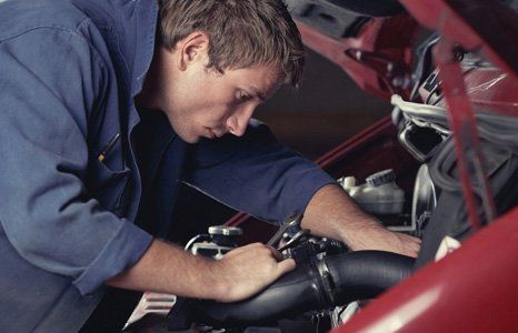 car mechanic checking checking the parts