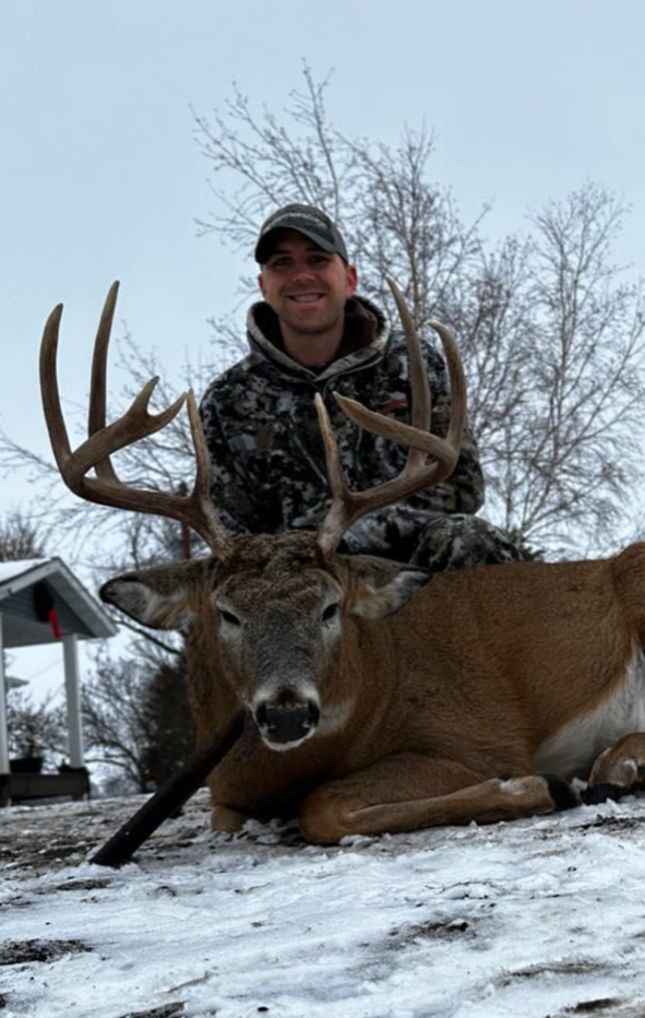 Man Holding A Deer