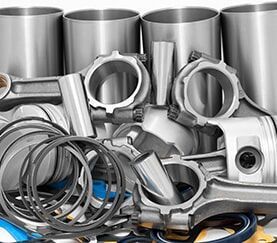 A Bunch of Metal Parts Are Sitting on Top of Each Other on a Table — Mechanical Repairs In Gympie, QLD