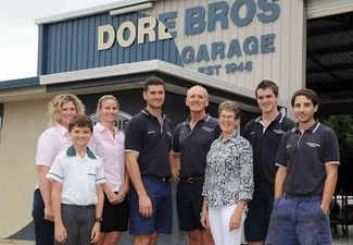 Group of People Standing in Front of a Building — Mechanical Repairs In Gympie, QLD