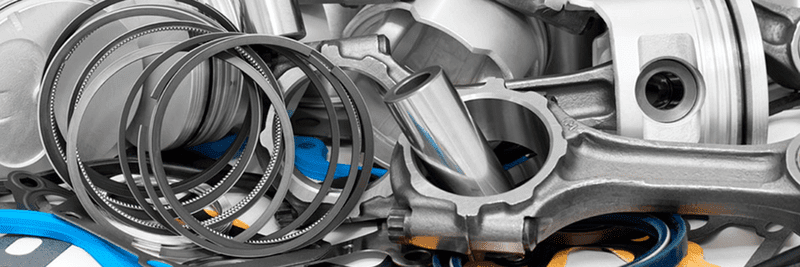 A Bunch of Metal Parts Are Sitting on Top of Each Other on a Table