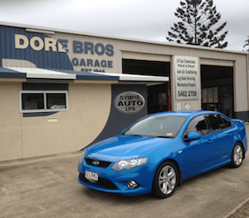 A Blue Car is Parked in Front of a Garage — Mechanical Repairs In Gympie, QLD