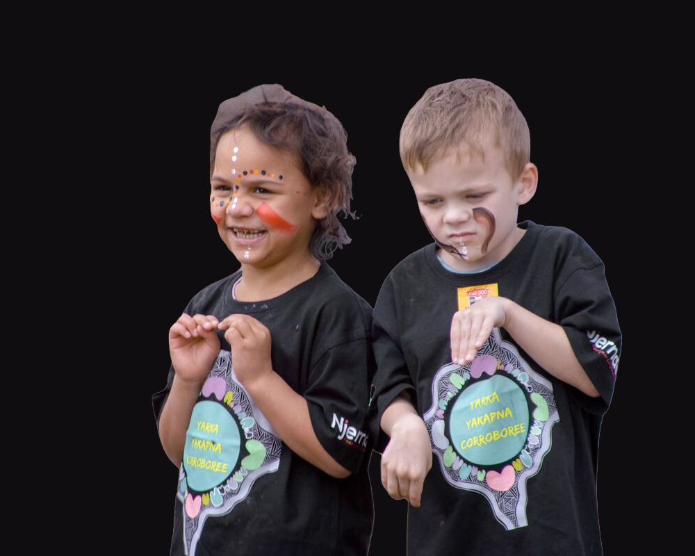 Two children in black shirts with face paint and matching logos, standing in front of a black background. One child smiles, the other looks down.