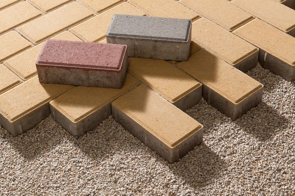 Three Coloured Bricks Laid on Grave  — Laurieton Landscape Supplies In Kew, NSW