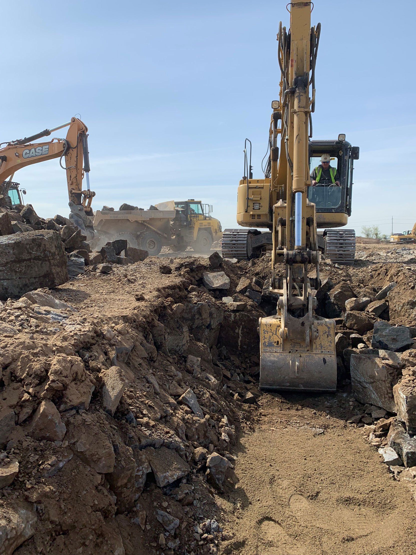 Backhoe Digging a Trench — Orchards, WA — Tilton Excavation