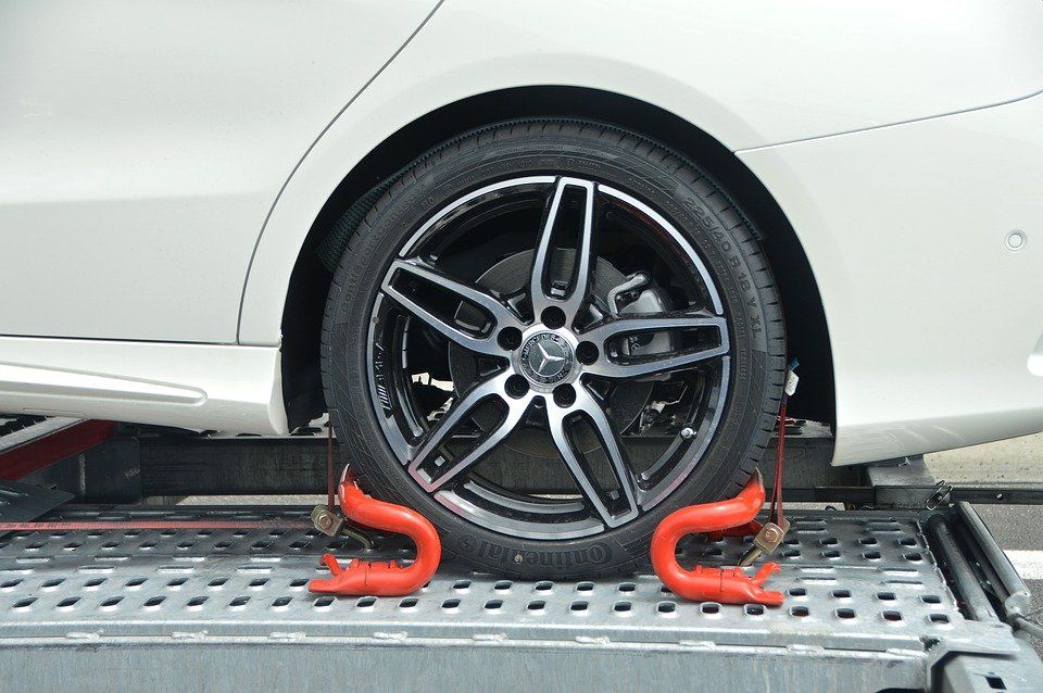 White Car Wheel Secured — Best Price Towing in Newcastle, NSW