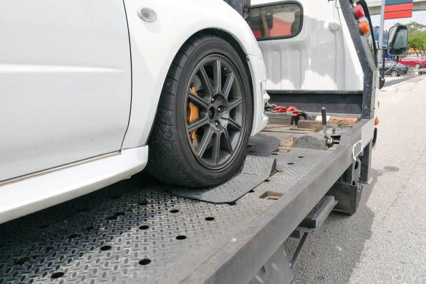 White Car Being Towed on a Flatbed Tow Truck — Best Price Towing in Gosford, NSW