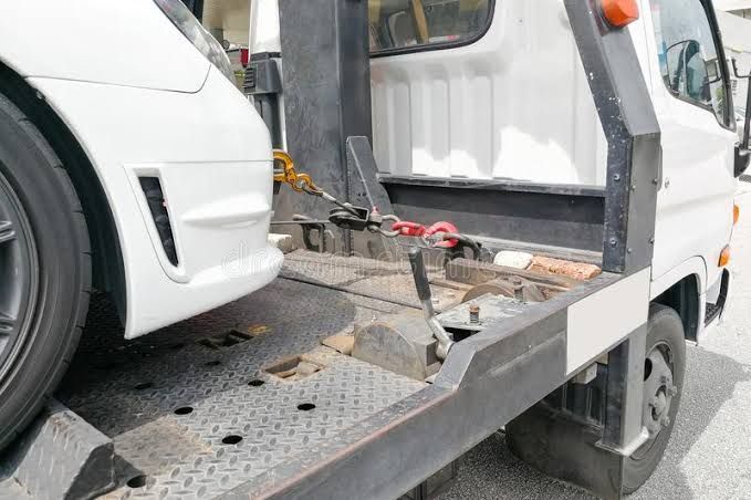 White Car Being Towed on a Flatbed Tow Truck — Best Price Towing in Budgewoi, NSW