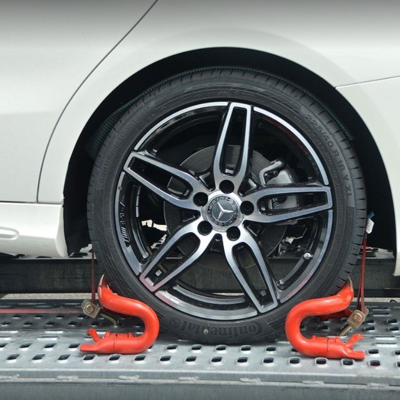 White Car Tire Secured on a Flatbed Truck — Best Price Towing in Lake Macquarie, NSW