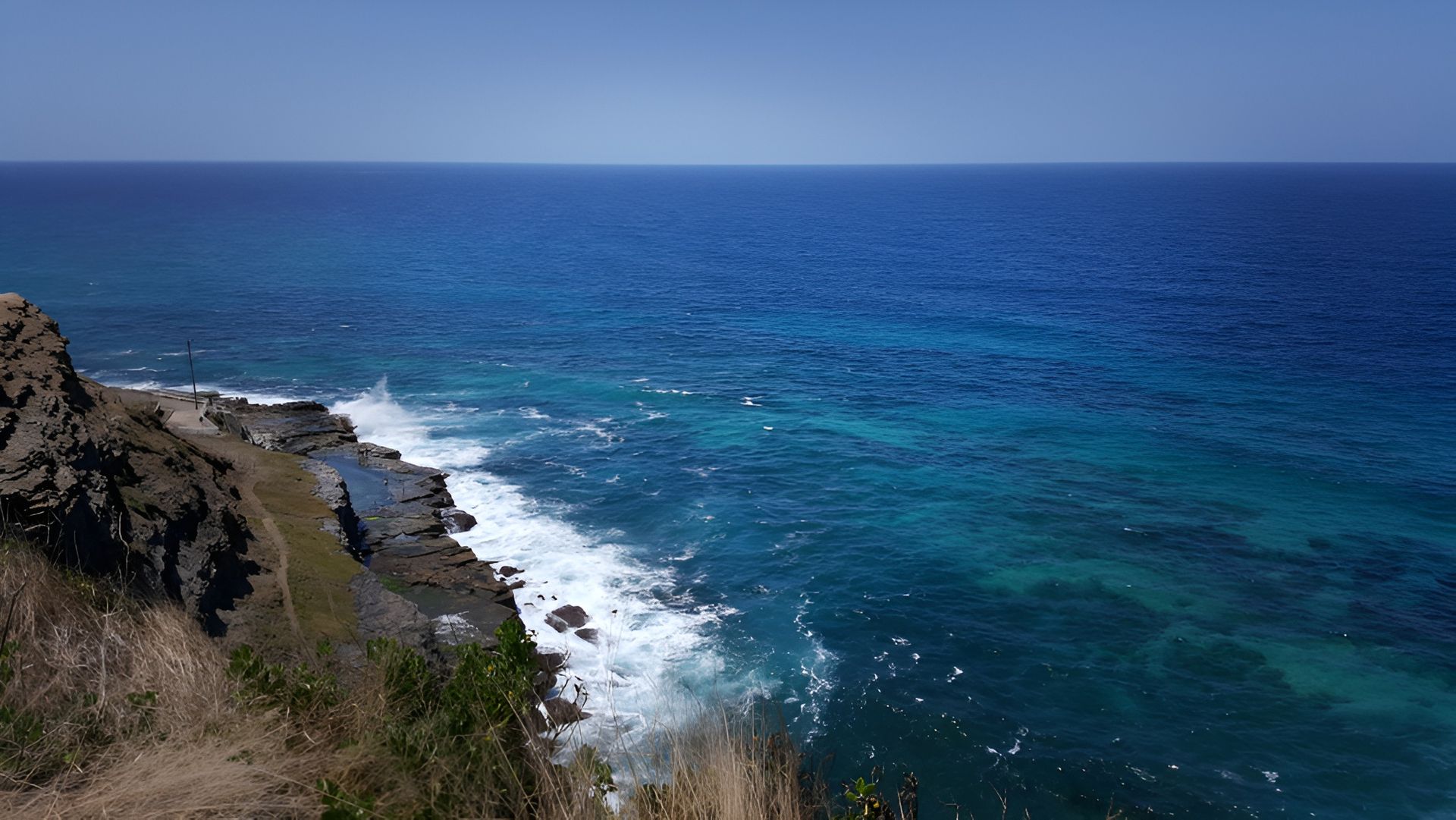 Ocean Waves Crash Against a Rocky Shoreline — Best Price Towing in Morisset, NSW