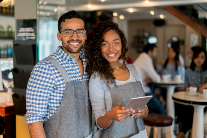 Happy-business-owners-with-store-full-of-customers-seo