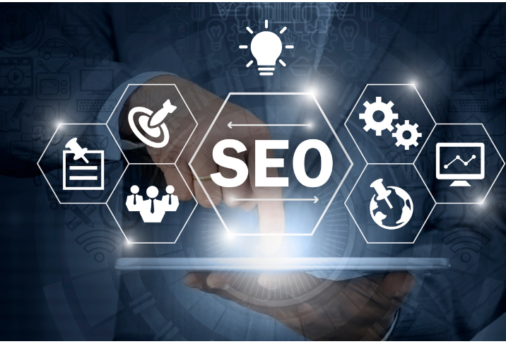 Person holding a tablet with a glowing SEO sign and related icons