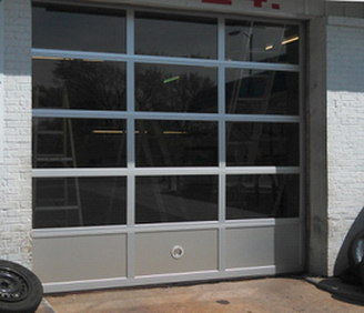 A garage door with a red cross on it
