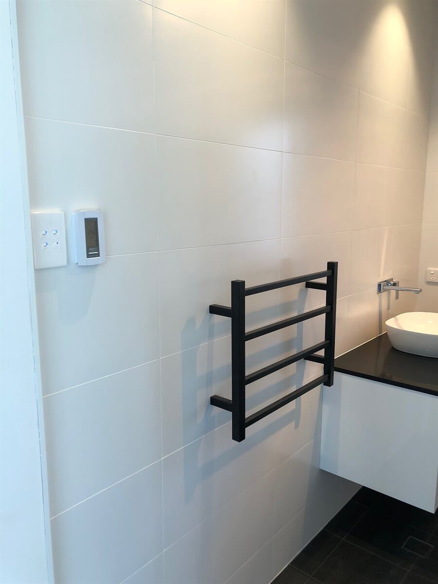 A Bathroom With A Sink And A Towel Rack On The Wall — L.A.F Electrical P/L In Empire Bay, NSW