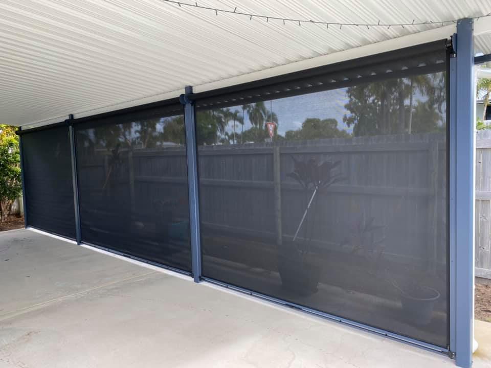 A Carport With a Screen on the Side of It — Whitsunday Blinds & Security In Beaconsfield, QLD