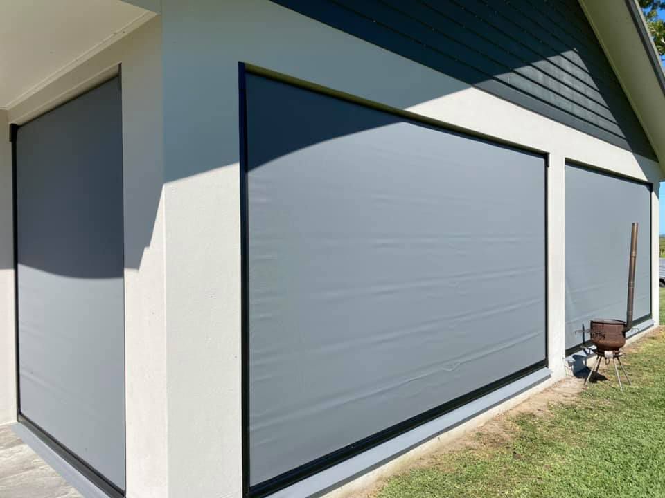 A Garage Door With a Grill on the Side of It — Whitsunday Blinds & Security In Beaconsfield, QLD