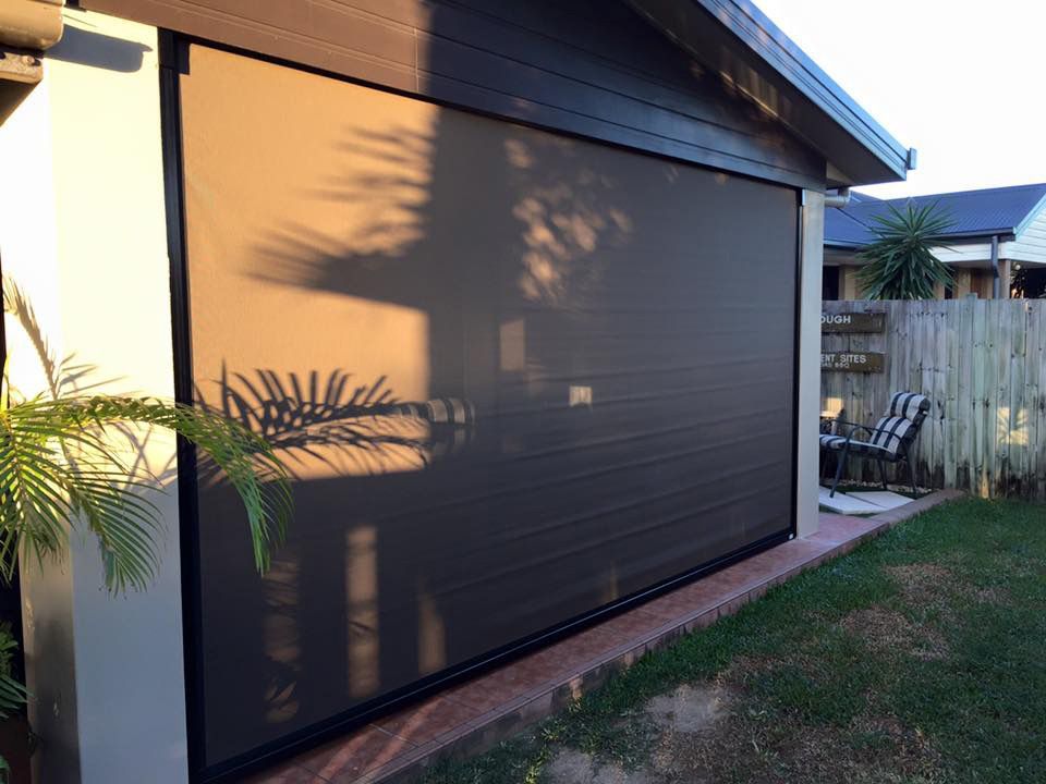 A House With a Large Screen on the Side of It — Whitsunday Blinds & Security In Beaconsfield, QLD