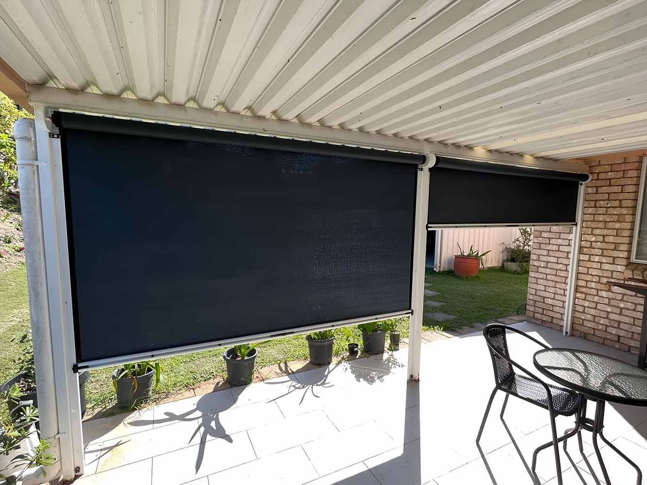 A Patio With a Table and Chairs Under a Canopy — Whitsunday Blinds & Security In Beaconsfield, QLD