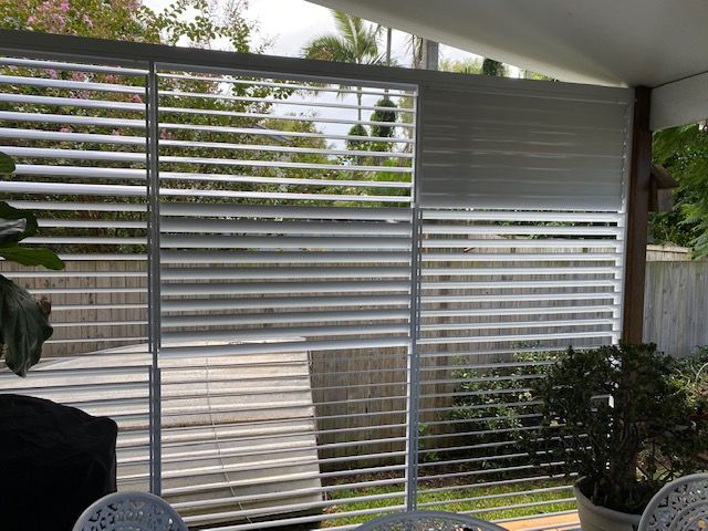 A Patio With Blinds on The Windows — Whitsunday Blinds & Security In Beaconsfield, QLD
