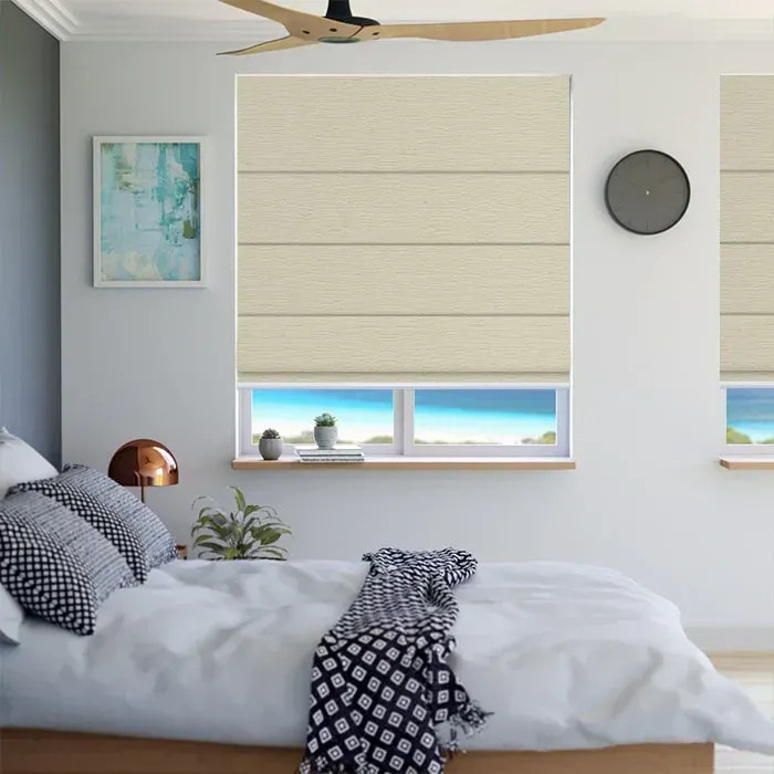 A Bedroom With a Large Bed and a Chair With Roman Blinds in a Big Windows — Whitsunday Blinds & Security In Beaconsfield, QLD