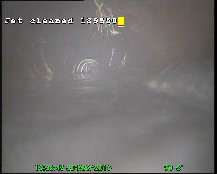 Inside a pipe, foggy view forward. 