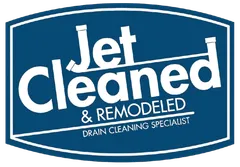Blue and white logo for "Jet Cleaned & Remodeled, Drain Cleaning Specialist." The text is on a blue background, in a rounded rectangle.