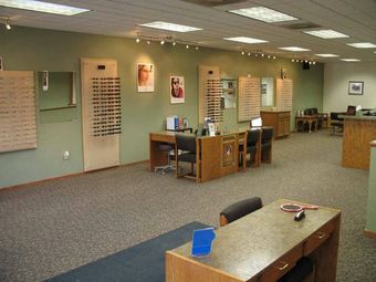 A large room with a lot of glasses on the wall