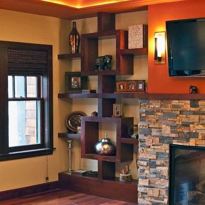 A living room with a fireplace and a flat screen tv