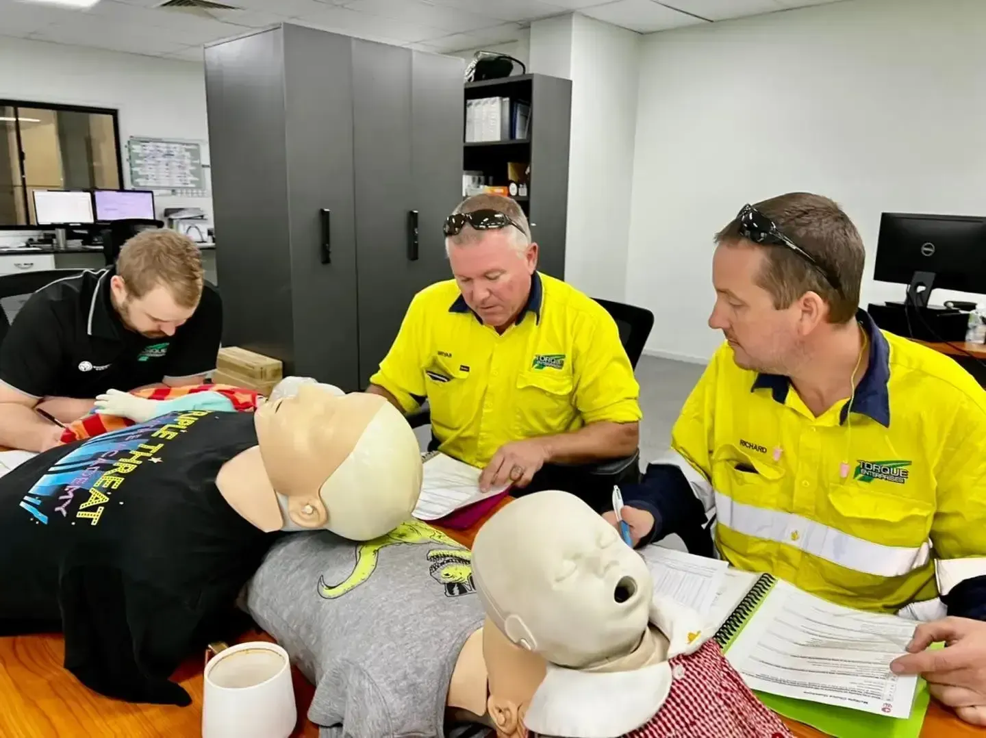 Instructor Showing CPR on Doll - First Aid in Mackay, QLD