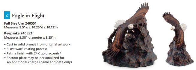 A statue of an eagle in flight on a rock