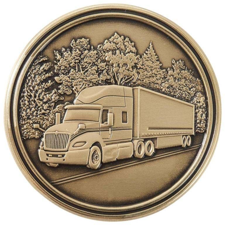 A gold coin with a semi truck on it