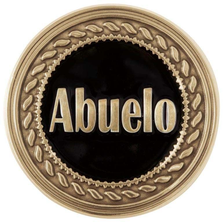A gold coin with the word abuelo on it
