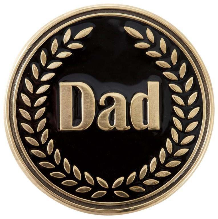 A gold coin with the word dad on it