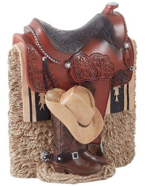 A statue of a saddle with a cowboy hat and boots on it
