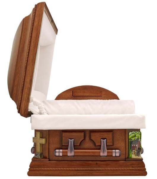 A wooden coffin with the lid open and a white cushion
