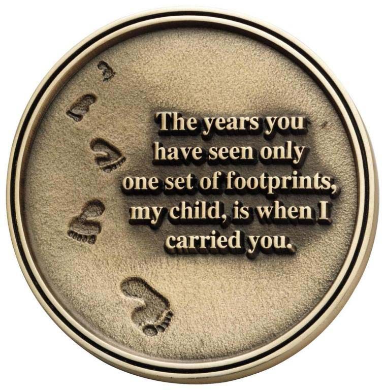 A coin that says the years you have seen only one set of footprints my child is when i carried you