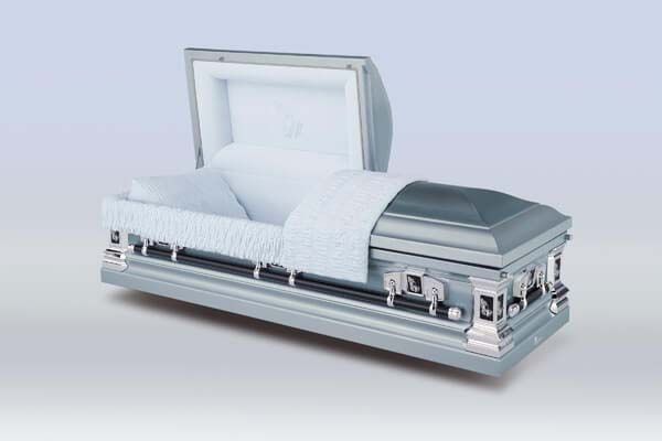 A silver coffin with the lid open and a white lining