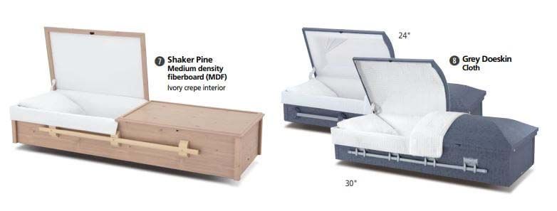 Two coffins are sitting next to each other with their lids open.