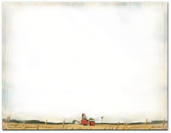 A picture of a barn in a field with a fence in the background.