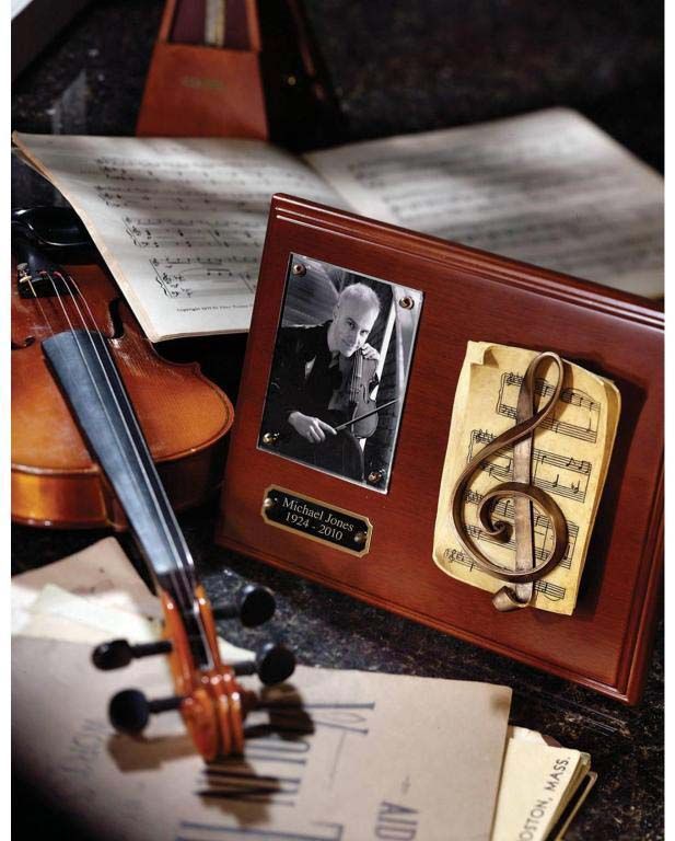 A violin sits next to a picture of a man and a treble clef