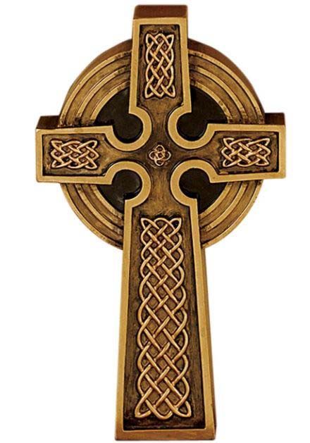 A cross with a celtic design on it is on a white background.