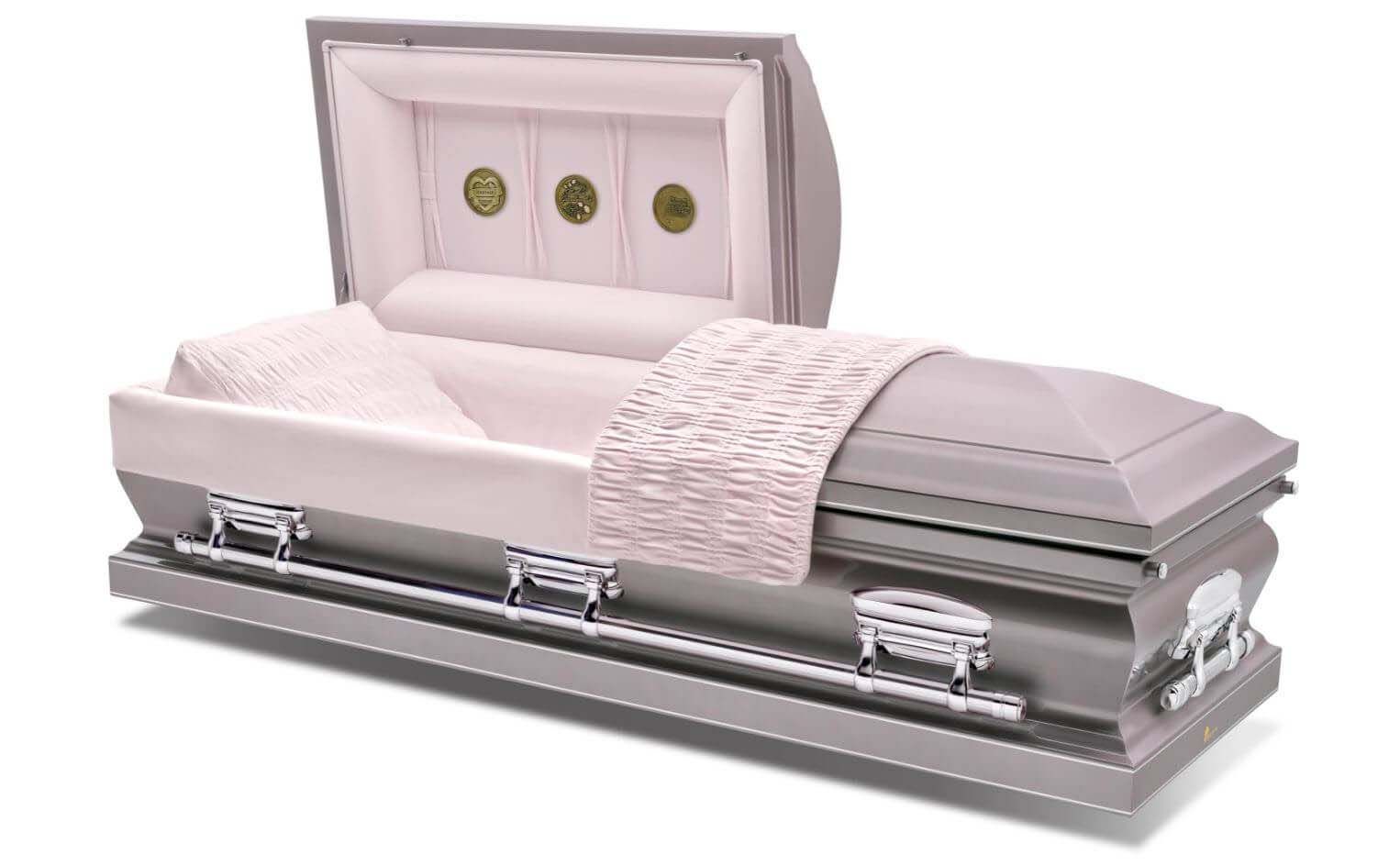 A silver coffin with the lid open and a pink blanket on it.