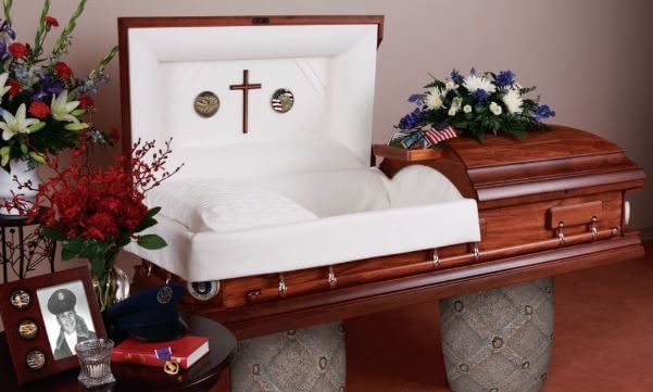 A coffin with a cross on the inside of it
