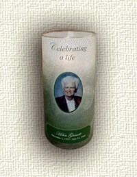 A candle with a picture of an elderly woman on it.