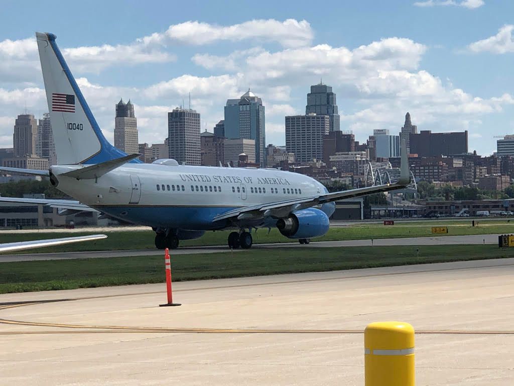 St. Louis skyline at sunset, featuring the Old Courthouse and modern skyscrapers under a colorful sky.