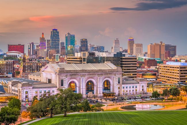 Kansas City skyline with Union Station in the foreground at sunset.