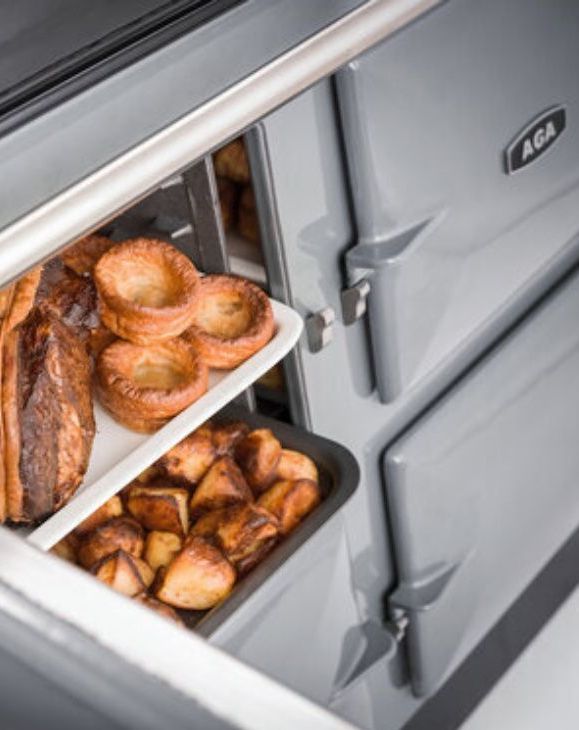 It's official! AGA cooked food really does taste better Food being removed from an AGA oven.